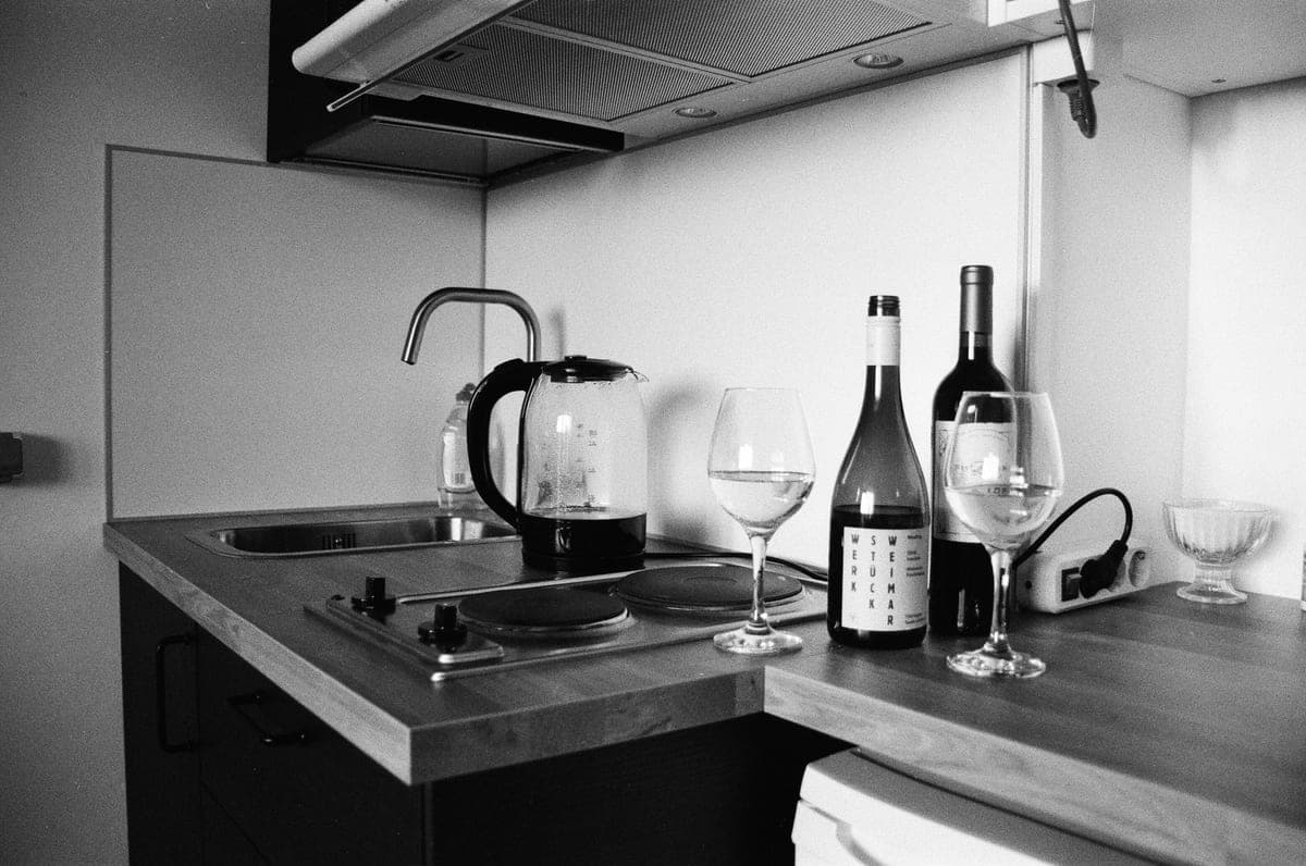 A wine bottle on a small kitchen counter