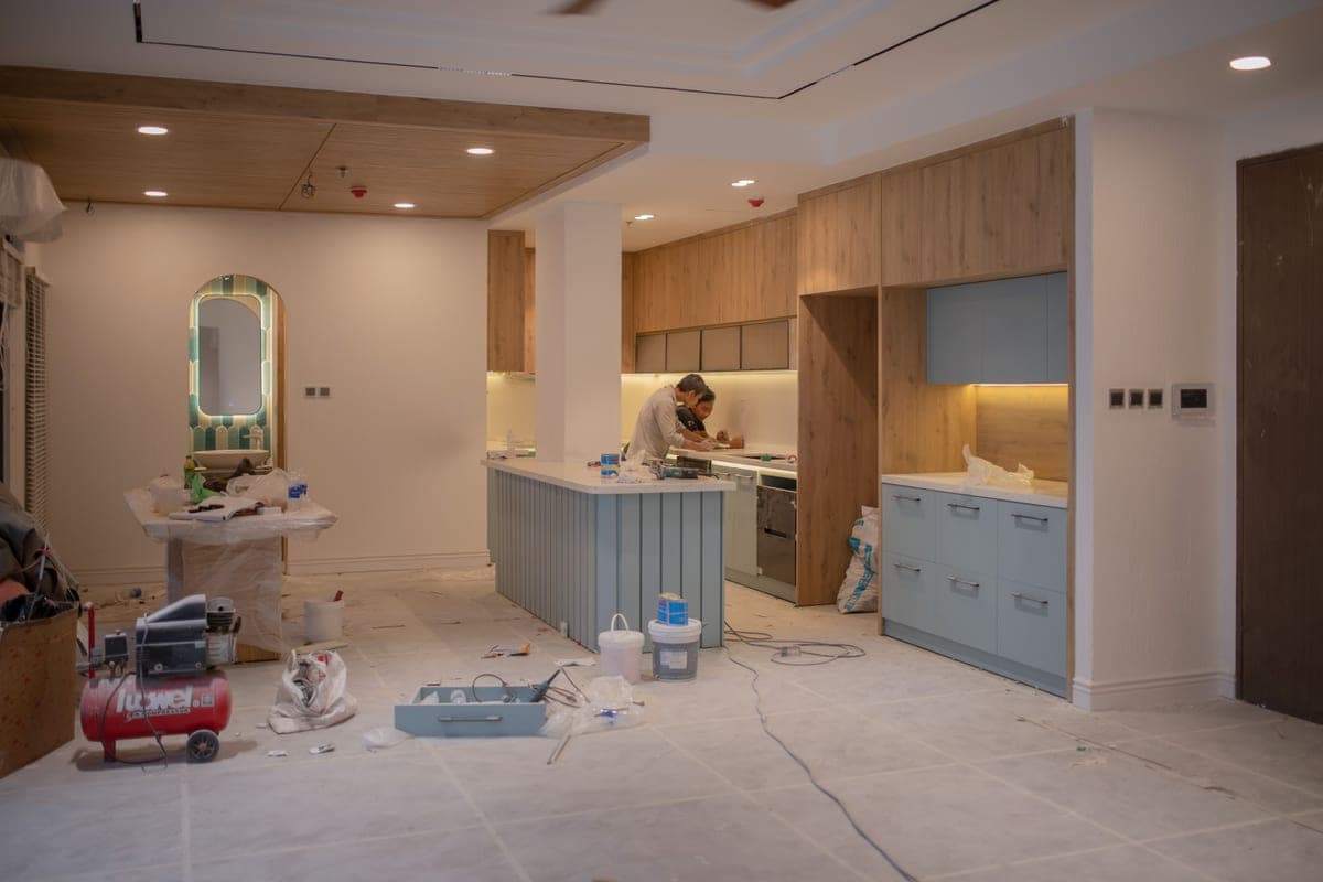 A kitchen under renovation with tools and materials in place
