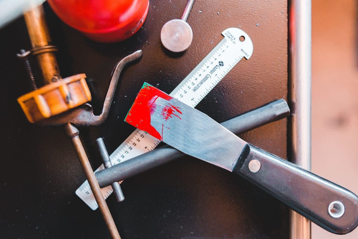Appliance repair tools laid out on a workbench