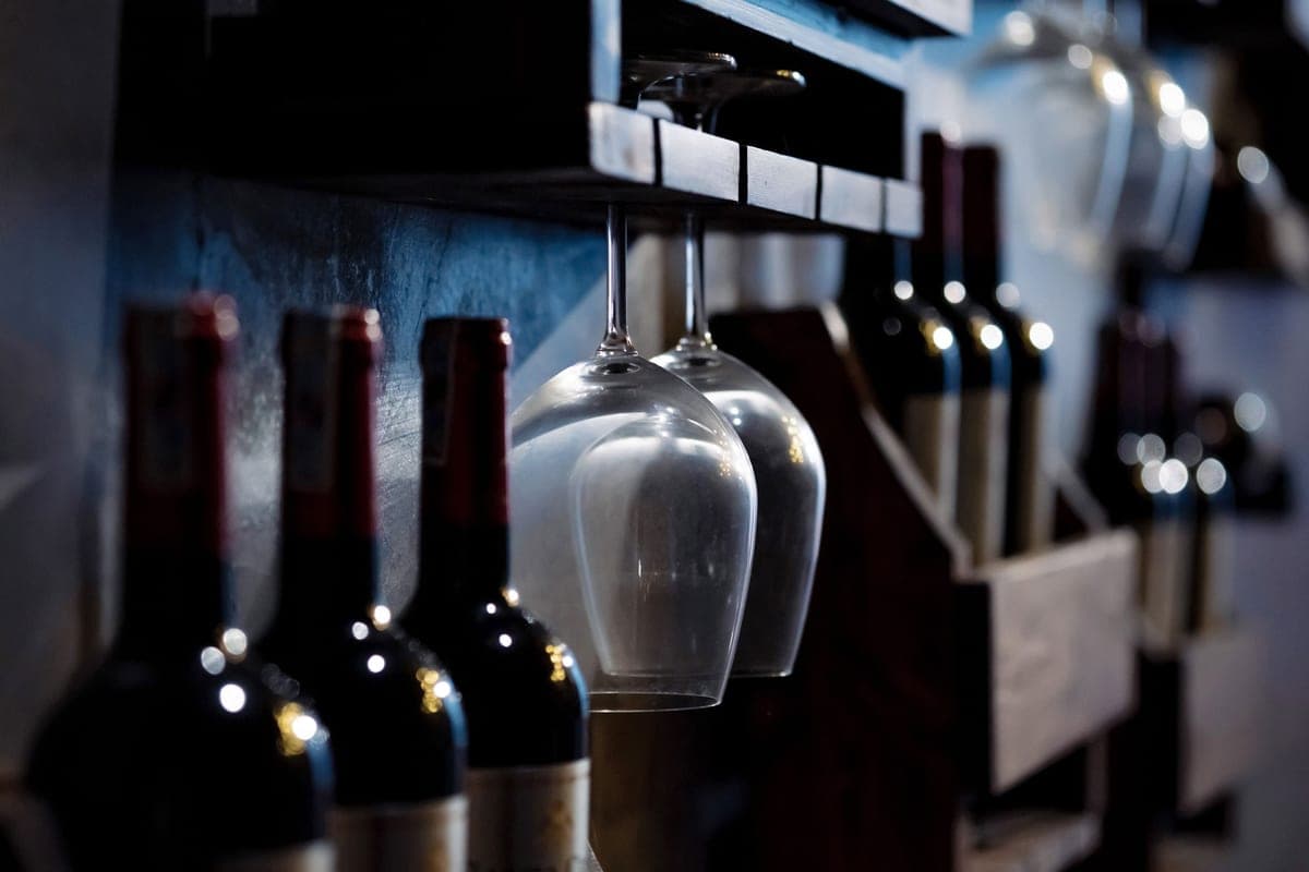 Wine bottles lying on their sides in a storage rack
