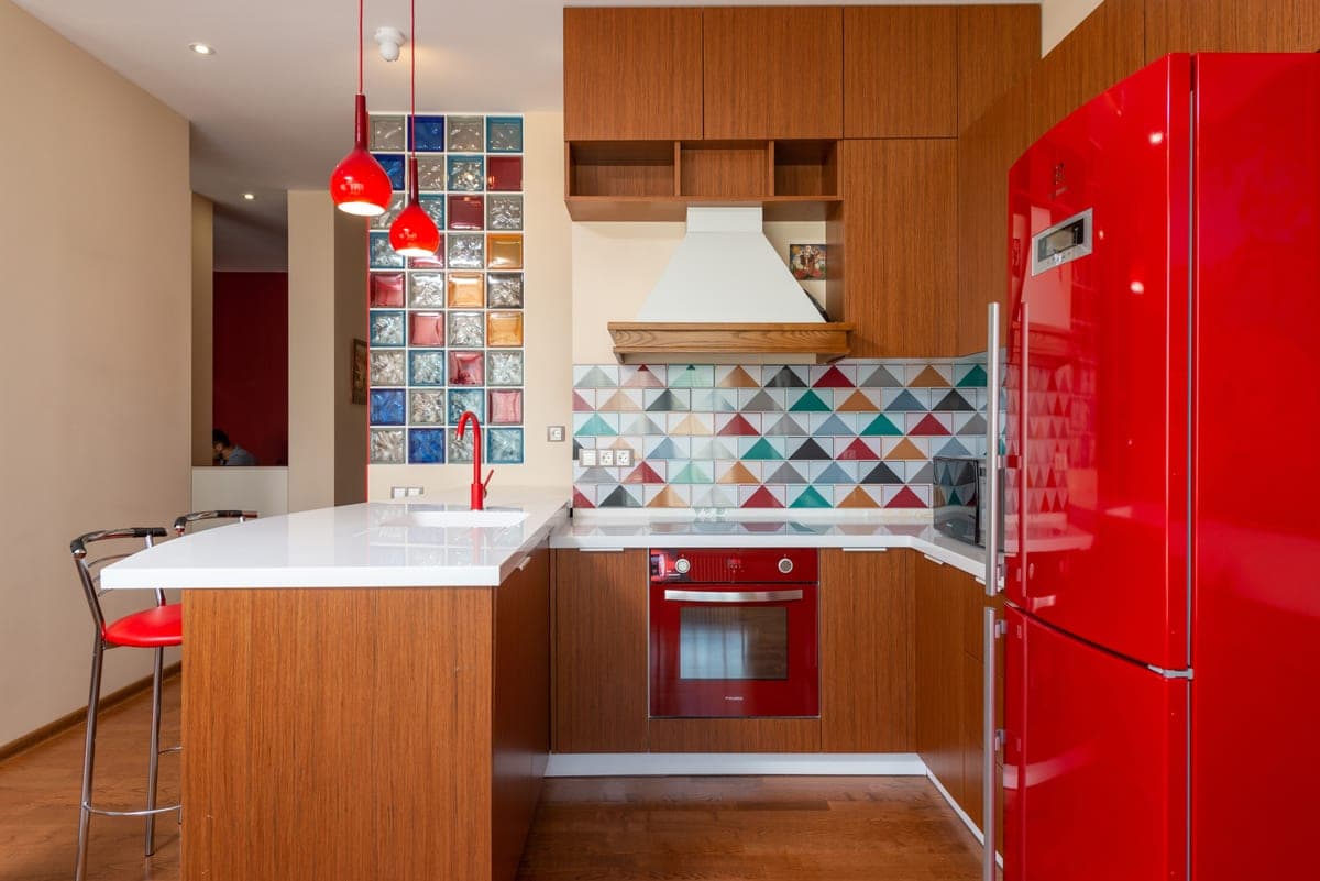 A compact refrigerator standing in a room