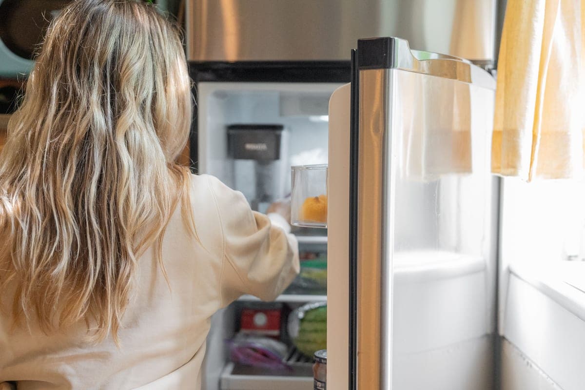 An open refrigerator stocked with food