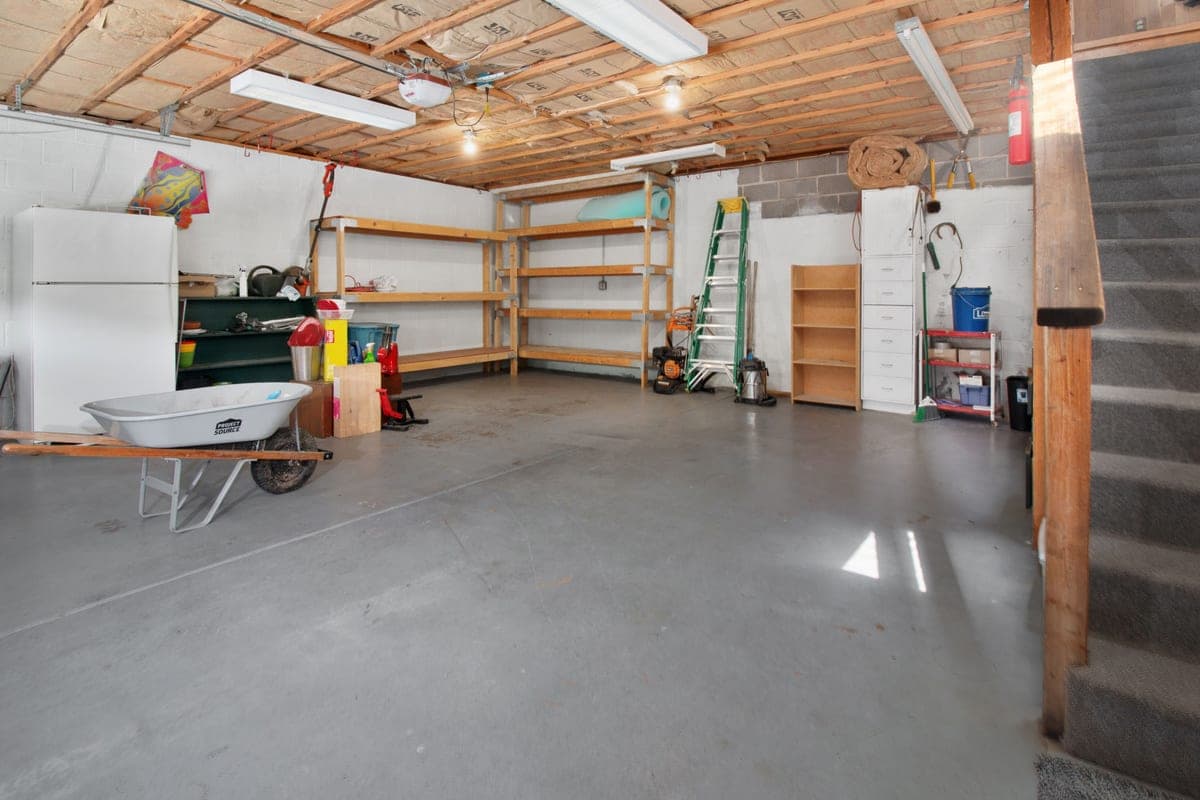 The interior of a garage with storage shelving