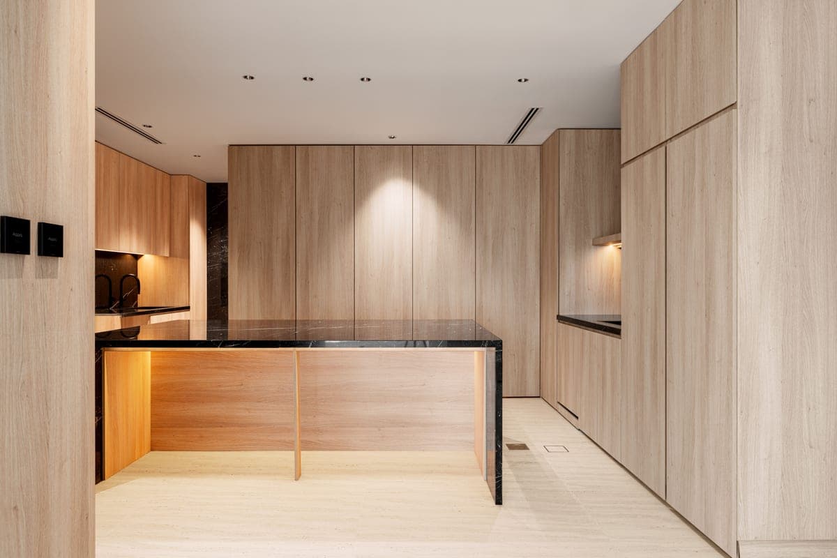 Fitted wooden kitchen cabinetry with a run of base units