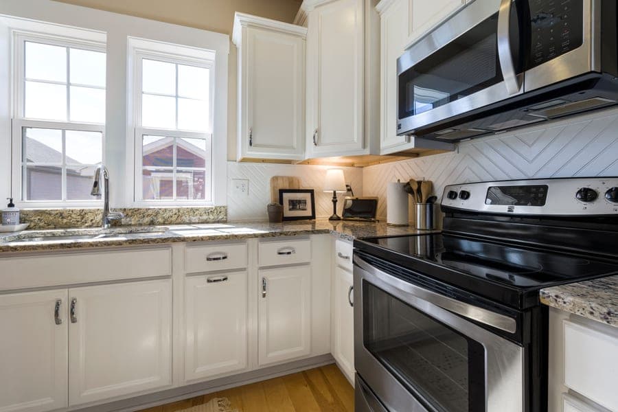 A stainless steel base cabinet front in a fitted kitchen